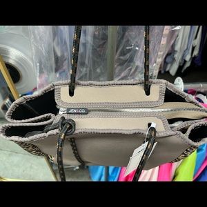 Jenn and Co.  Animal print scuba like fabric Purse with zip pouch.